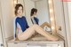 A woman sitting on a bathroom counter in front of a mirror.