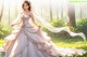 A woman in a wedding dress standing in the woods.